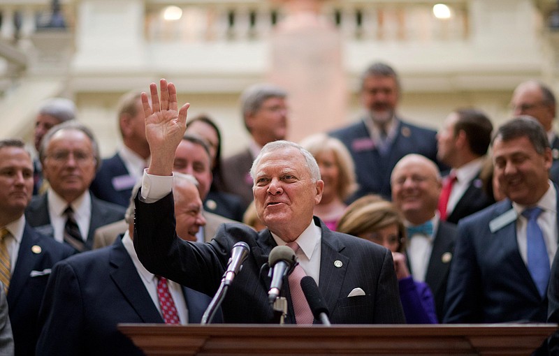 Georgia Gov. Nathan Deal waves as he begins a press conference on a transportation improvement plan for the state at the Capitol Tuesday, Jan. 12, 2016, in Atlanta. 