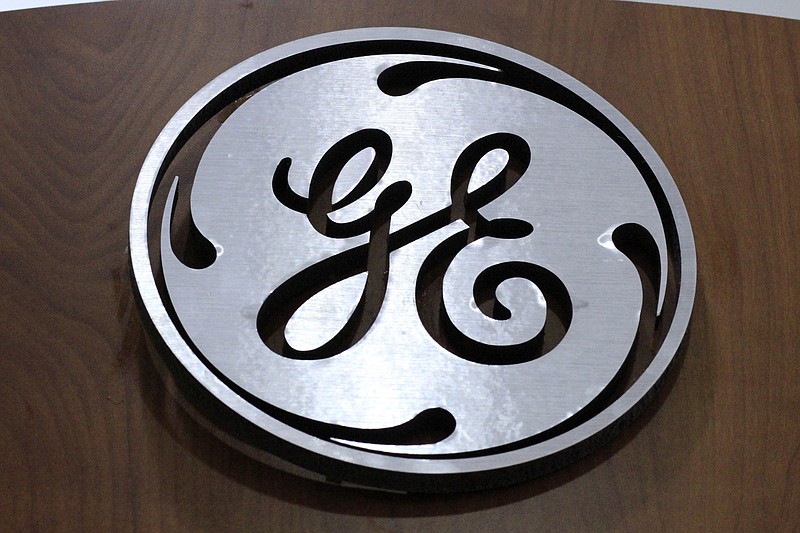 
              FILE - This Jan. 16, 2014 file photo shows the General Electric logo at a store in Cranberry Township, Pa. General Electric announced Wednesday, Jan. 13, 2016, it will move its headquarters from Fairfield, Conn., to the Seaport District of Boston. (AP Photo/Gene J. Puskar, File)
            