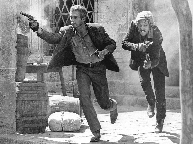 ** FILE ** In this 1969 file photo, actors Paul Newman, left, as Butch Cassidy, and Robert Redford, as the Sundance Kid, appear in the final shootout scene in the film ''Butch Cassidy and the Sundance Kid.''  Newman, the Academy-Award winning superstar who personified cool as an activist, race car driver, popcorn impresario and the anti-hero of such films as "Hud," "Cool Hand Luke" and "The Color of Money," has died, a spokeswoman said Saturday. He was 83. Newman died Friday, Sept. 26, 2008, of cancer, spokeswoman Marni Tomljanovic said. (AP Photo/20th Century Fox, File) ** NO SALES ** 