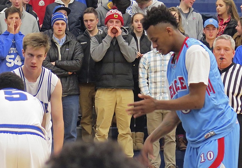 Whitefish Bay High School fans cheer during a home game against Milwaukee Morse-Marshall on Tuesday. The director of the Wisconsin Interscholastic Athletic Association has apologized to administrators around the state for the distraction generated by an email urging them to prevent fans from taunting opponents with chants considered harmless by some.