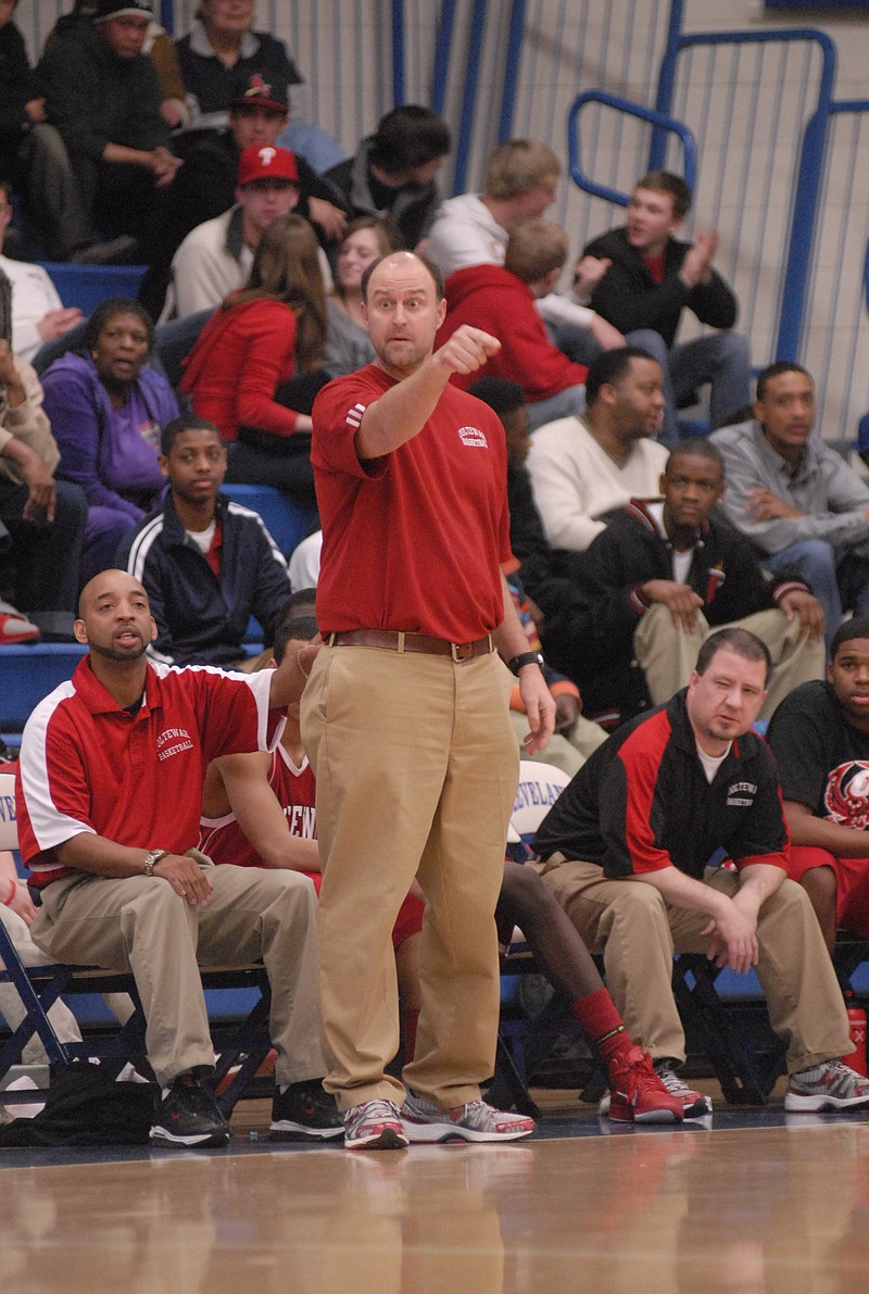 Jesse Nayadley, now Ooltewah's athletic director, was the Owls' basketball coach in this 2010 game with Andre "Tank" Montgomery, seated just to his left, as an assistant coach. Montgomery succeeded Nayadley as head coach and served in that role until the 2015-16 season recently was canceled.