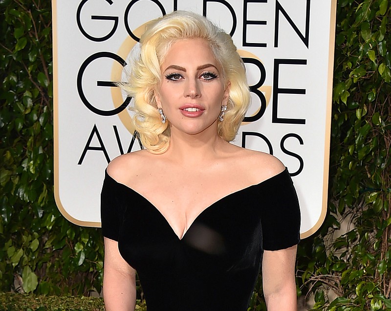 
              FILE - In this Jan. 10, 2016 file photo, Lady Gaga arrives at the 73rd annual Golden Globe Awards in Beverly Hills, Calif. Gaga’s "Til It Happens to You," the song she wrote with Diane Warren for the sexual assault documentary, "The Hunting Ground," was nominated for an Oscar for best original song on Thursday, Jan. 14, 2016. (Photo by Jordan Strauss/Invision/AP, FIle)
            