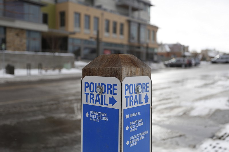 
              In this Dec. 17, 2015 photo, a sign directs walkers to the Poudre River Trail, in Fort Collins, Colo. The picturesque Colorado river with a peculiar French name is the latest prize in the West’s water wars, where wilderness advocates usually line up against urban and industrial development. This showdown has a new force: City folks, who say having a vibrant river flow past their streets, parks and buildings is essential to their community’s identity and well-being. (AP Photo/Brennan Linsley)
            