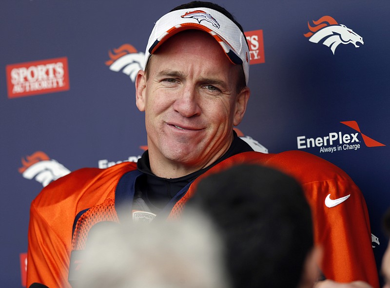 FILE - In this Jan. 7, 2015, file photo, Denver Broncos quarterback Peyton Manning considers a question after practice for an NFL football divisional playoff game against the Indianapolis Colts, in Englewood, Colo. In the span of a few short weeks, dating to his relief appearance for the Broncos on Jan. 3, the narrative about the 39-year-old's trials and travails has shifted. (AP Photo/David Zalubowski, File)