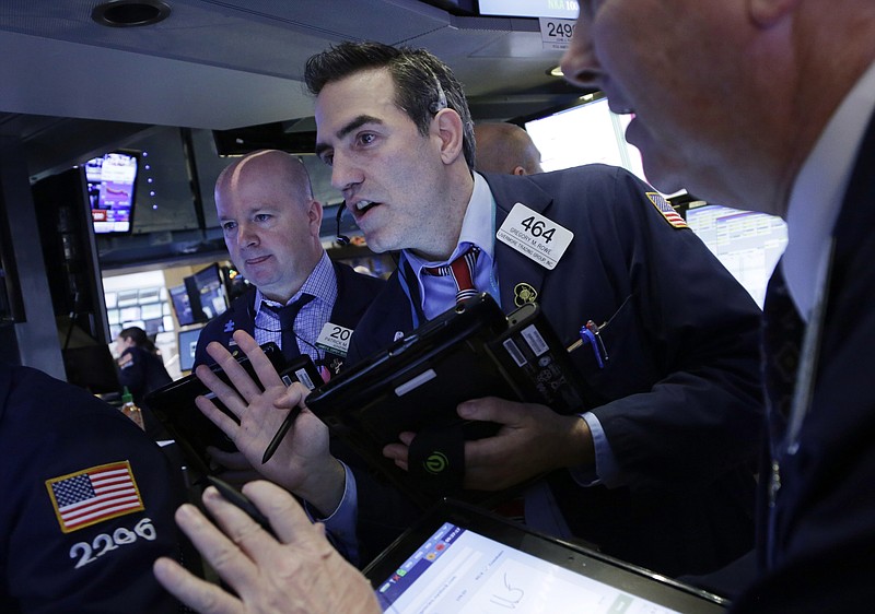 Stock traders follow stock prices at the New York Stock Exchange, Friday, Jan. 15, 2016. (AP Photo/Mark Lennihan)