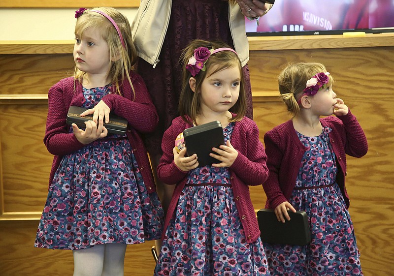 FORT OGLETHORPE, Ga. (Jan. 14, 2016) The daughters of Logistics Specialist 2nd Class Randall Smith stand together after being presented miniature Purple Heart Medals during a ceremony Jan 14, at the Fort Oglethorpe City Hall in honor of their father's heroic actions. Smith sustained fatal gunshot wounds during the terrorist shootings July 16, 2015 at the Navy Operational Support Center in Chattanooga, Tenn. (U.S. Navy photo by Mass Communications Specialist 1st Class America A. Henry/Released)