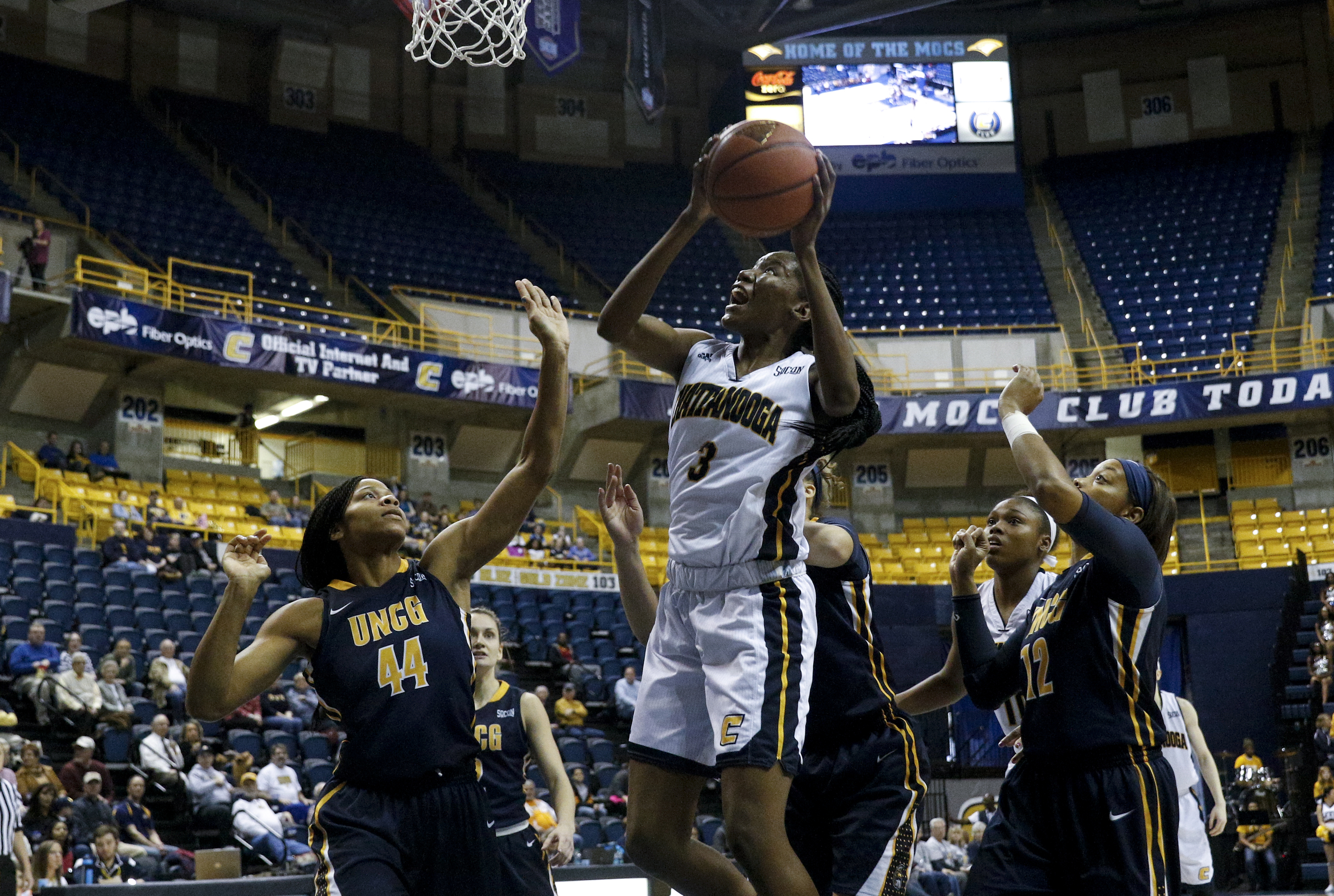 UTC forward Jasmine Joyner (3) shoots between UNC Greensboro's Mariah Wilson (44) and Lucy Mason during the Mocs' 72-61 win Saturday afternoon in McKenzie Arena. Joyner had 18 points and 14 rebounds, while Mason scored 26 points in defeat.