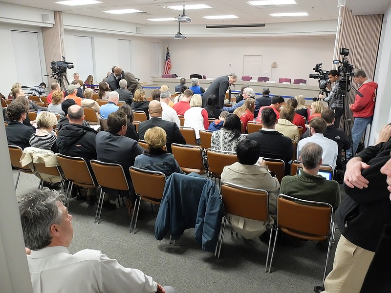 A large crowd gathers inside the school board meeting room Wednesday night.