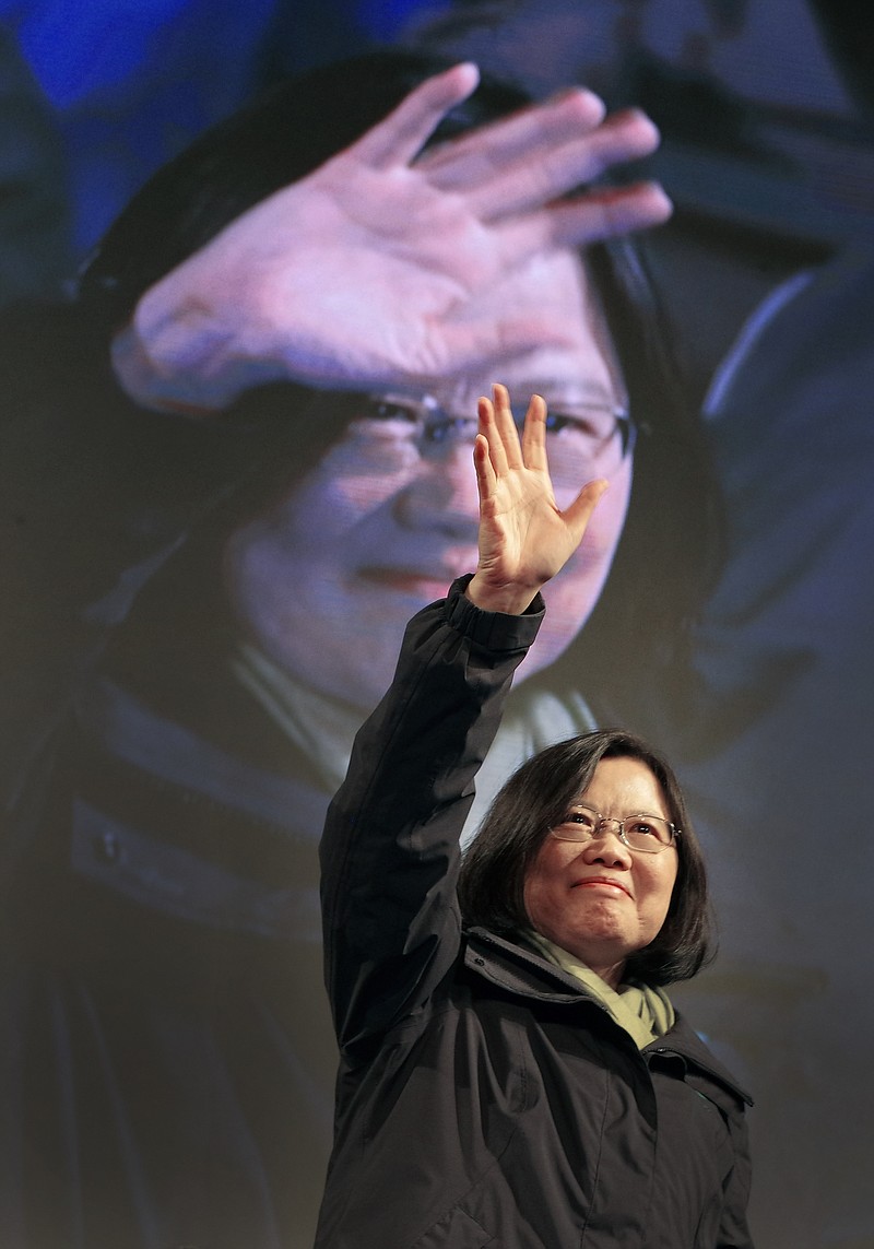 
              Taiwan's Democratic Progressive Party, DPP, presidential candidate, Tsai Ing-wen, raises her hands as she declares victory in the presidential election Saturday, Jan. 16, 2016, in Taipei, Taiwan. (AP Photo/Vincent Yu)
            