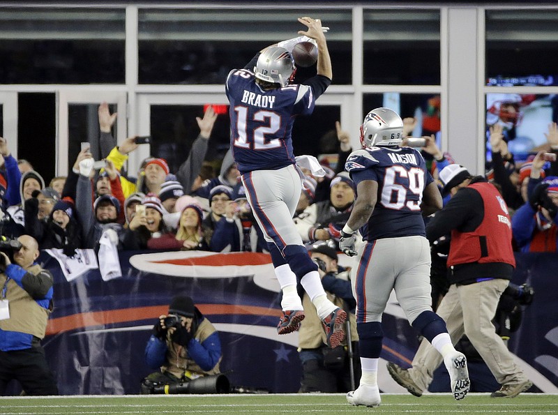 New England Patriots quarterback Tom Brady (12) celebrates his touchdown pass to New England Patriots tight end Rob Gronkowski (87) in the second half of an NFL divisional playoff football game against the Kansas City Chiefs, Saturday, Jan. 16, 2016, in Foxborough, Mass. (AP Photo/Elise Amendola)
