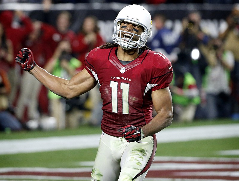 Arizona Cardinals wide receiver Larry Fitzgerald (11) celebrates his catch in the red zone to set up a game winning touchdown against the Green Bay Packers during the second half of an NFL divisional playoff football game, Saturday, Jan. 16, 2016, in Glendale, Ariz. The Cardinals won 26-20 in overtime. (AP Photo/Ross D. Franklin)