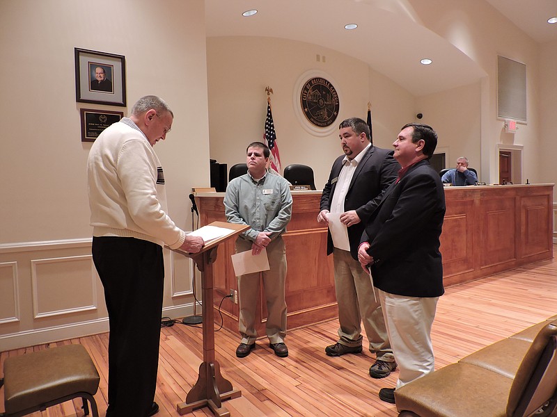 Ray Campbell, left, swears in Rossville councilmen Brad Buff and Michael Hicks and Mayor Teddy Harris, from left. Buff is the son of incumbent Councilman Rick Buff. "I want to congratulate the new council members," Rick Buff said following their swearing-in. "I've known them both a real long time. We are not giving up on Rossville. We will get some things done. We are not through with this city. It can be a beautiful city to live in and call your home. Never be ashamed to say, 'I'm from Rossville, Georgia.'"