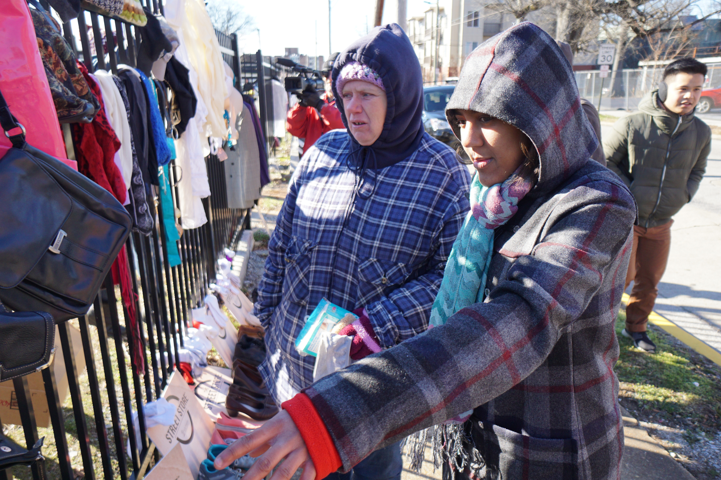 Staff Photo by Dan Henry / The Chattanooga Times Free Press- 1/18/16. Southern Adventist University senior classman Lauren Hall, right, helps Lisa Johnson put together an outfit as SAU hosts the second annual ғtreet StoreӠin partnership with the Salvation Army on January 18, 2016. Street Stores are sidewalk pop-up shops that offers free clothes to the homeless, providing them with a dignified shopping experience as they try on and select their own garments. More than 4,000 individuals experience homelessness each year in Chattanooga alone.