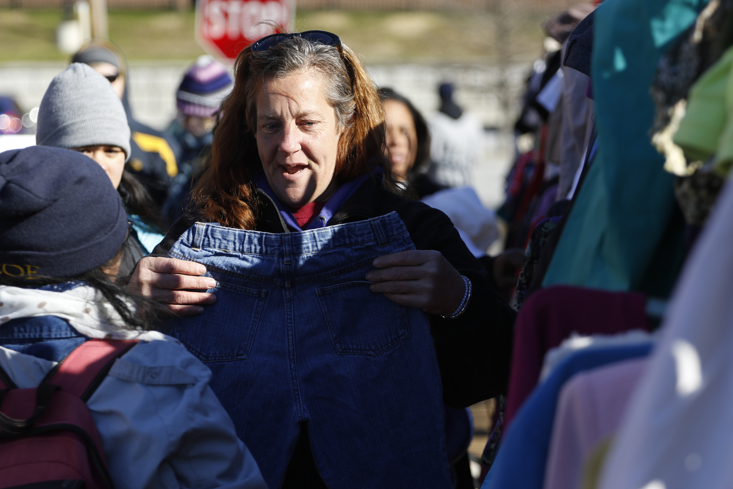 Staff Photo by Dan Henry / The Chattanooga Times Free Press- 1/18/16. Donna Defraneo looks for a pair of pants as Southern Adventist University hosts the second annual ғtreet StoreӠin downtown Chattanooga in partnership with the Salvation Army on January 18, 2016. Street Stores are sidewalk pop-up shops that offers free clothes to the homeless, providing them with a dignified shopping experience as they try on and select their own garments. More than 4,000 individuals experience homelessness each year in Chattanooga alone.
