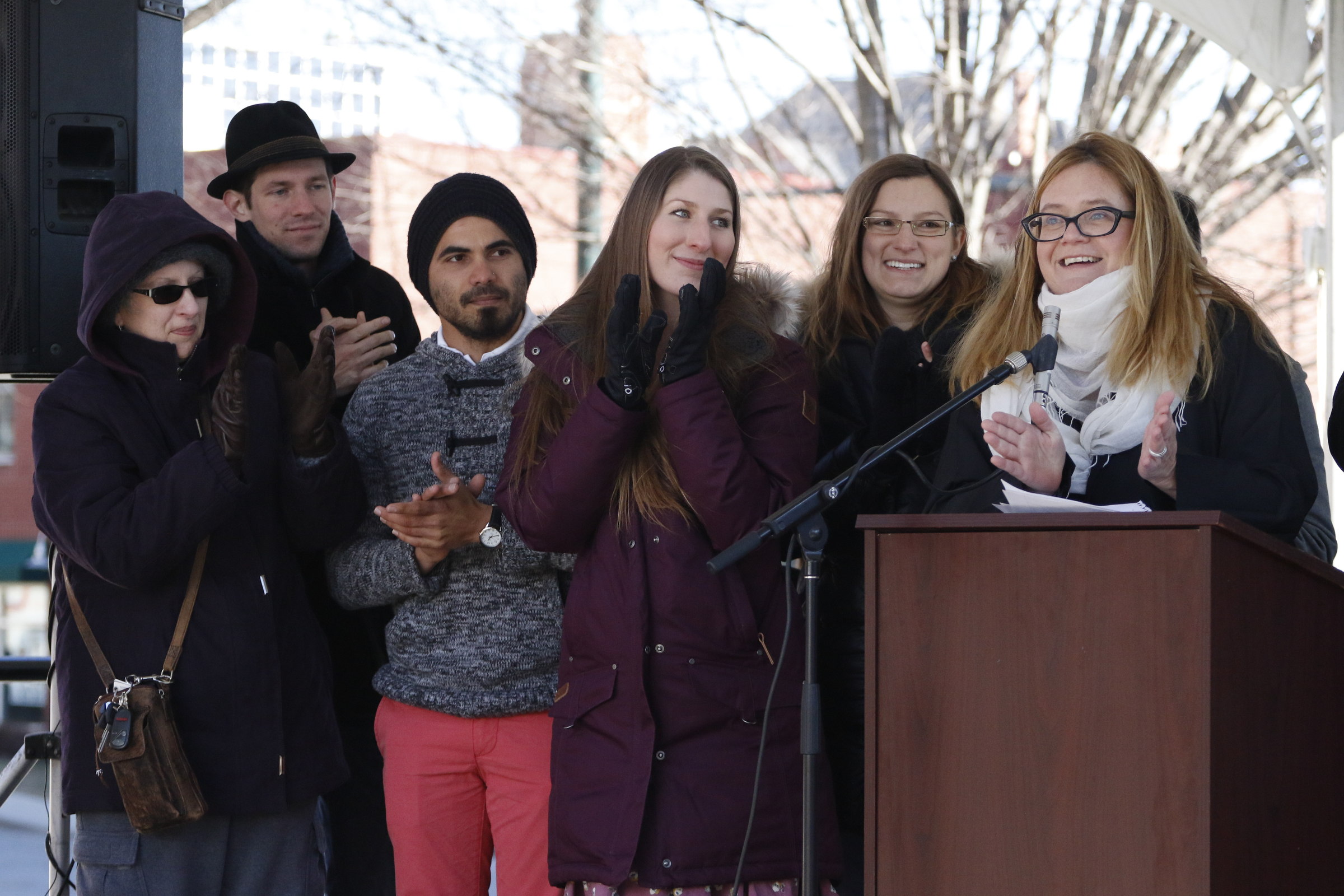 Staff Photo by Dan Henry / The Chattanooga Times Free Press- 1/18/16. Meg Salesman, right, recognizes the mural team she worked with to complete the $200,000 M.L. King Blvd. mural project during a dedication ceremony on January 18, 2016.