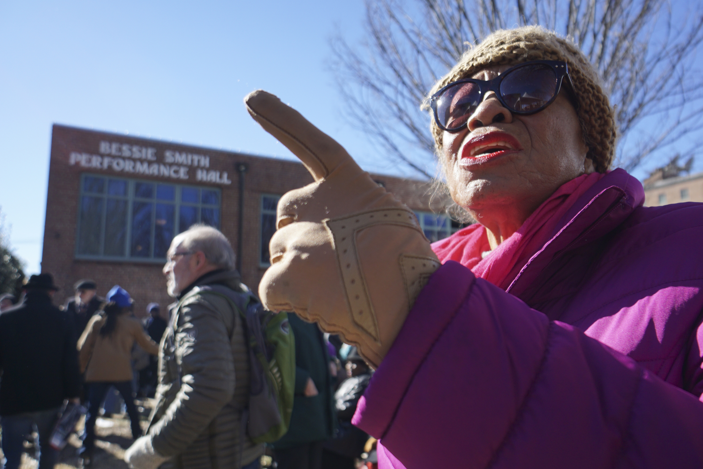 Staff Photo by Dan Henry / The Chattanooga Times Free Press- 1/18/16. Dr. Juanita Loundmonclay sings along during the dedication of the $200,000 M.L. King Blvd. mural project on January 18, 2016.