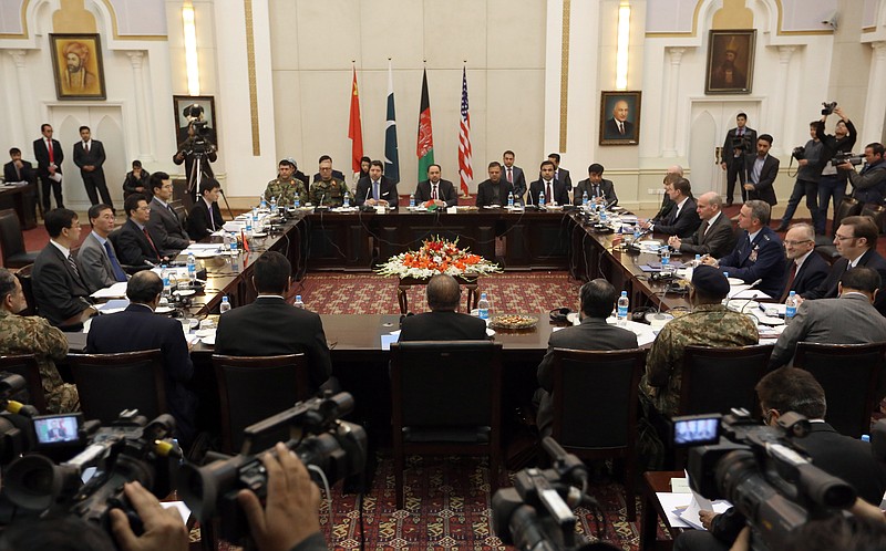 
              Delegations from Afghanistan, Pakistan, The United States of America and China discuss a road map for ending the war with the Taliban at the Presidential Palace in Kabul, Afghanistan, Monday, Jan. 18, 2016. Representatives of four countries met in the Afghan capital Kabul on Monday for a second round of talks aimed at bringing an end to Afghanistan's war by charting a roadmap to peace, a Foreign Ministry official said. (AP Photo/Rahmat Gul)
            