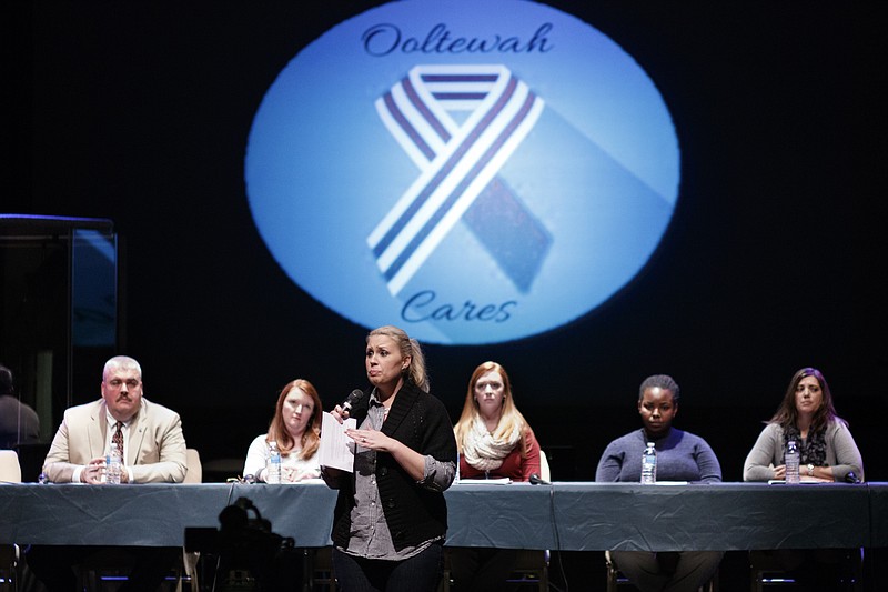 Miranda Perez introduces a group of panelists during a discussion at Ooltewah United Methodist Church on Tuesday, Jan. 19, 2016, in Ooltewah, Tenn. The meeting was held for parents to hear from experts about signs of and solutions to bullying and abuse, and it was held in the wake of the sexual assault of an Ooltewah High School freshman during an overnight basketball trip to Gatlinburg, Tenn., in December.
