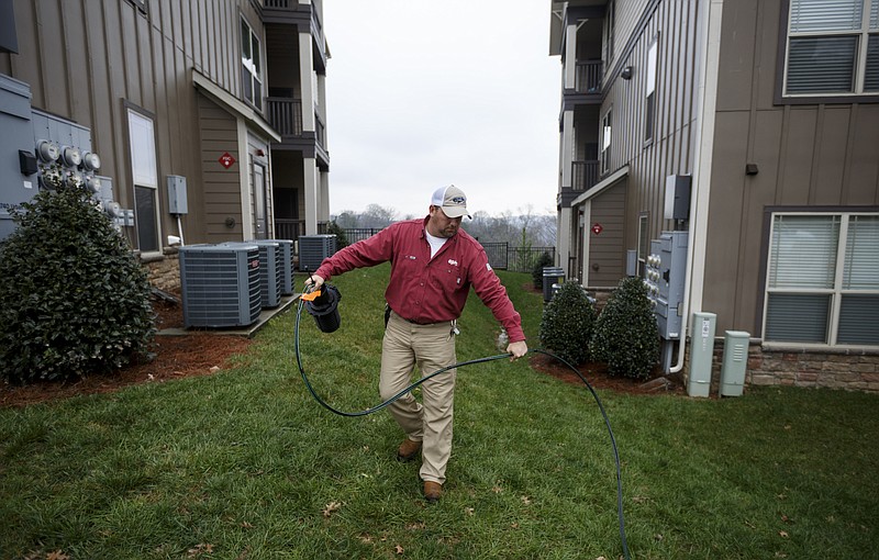 Service technician Stacy Mann winds together a newly installed fiber optic cable during an EPB installation at CityGreen Apartments on Friday, Jan. 15, 2016, in Chattanooga, Tenn.