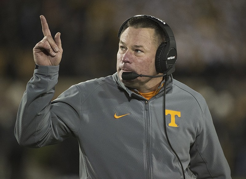 Tennessee head coach Butch Jones points to the scoreboard during the first quarter of an NCAA college football game against Missouri Saturday, Nov. 21, 2015, in Columbia, Mo. Tennessee won the game 19-8. (AP Photo/L.G. Patterson)