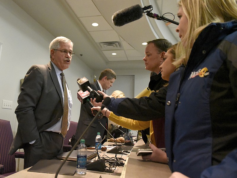 School Superintendent Rick Smith talks to reporters after asking for a buyout of his contract at the Hamilon County School Board.