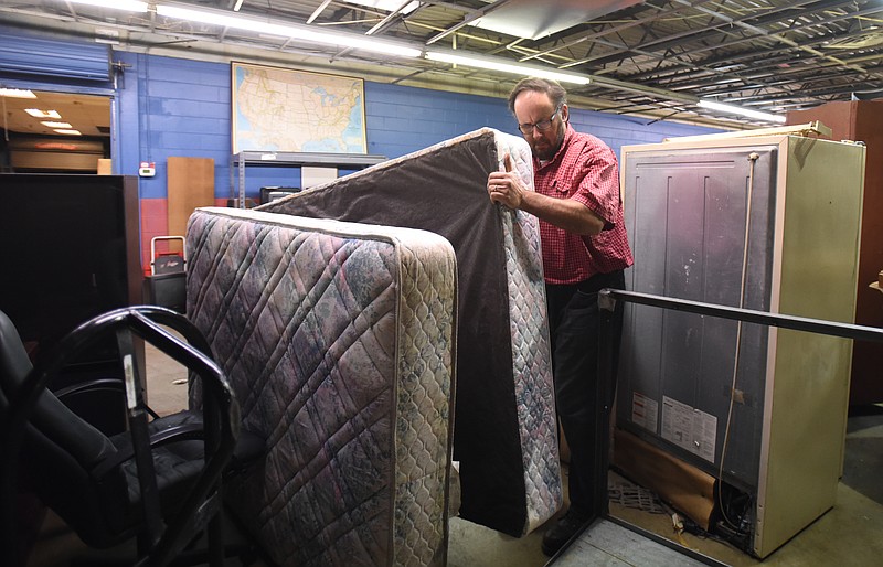 Program director Lee Barton works at the Chattanooga Furniture Bank on Thursday, January 14, 2016.