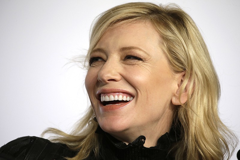 
              FILE - In this May 17, 2015, file photo, actress Cate Blanchett attends a press conference for the film "Carol" at the 68th International Ffilm Festival in Cannes, southern France. Two-time Oscar winner Cate Blanchett has brought her latest film, the 1950s lesbian romance "Carol," to Tokyo. The movie, which has been a critical smash since it premiered at the Cannes Film Festival, is up for six Academy Awards, including best actress for Blanchett and best supporting actress for her co-star Rooney Mara. The movie features one sex scene between the two characters, which Blachett said Friday, Jan. 22, 2016, she approached just as she would have with a male co-star, except "the bits are different." (AP Photo/Lionel Cironneau, File)
            