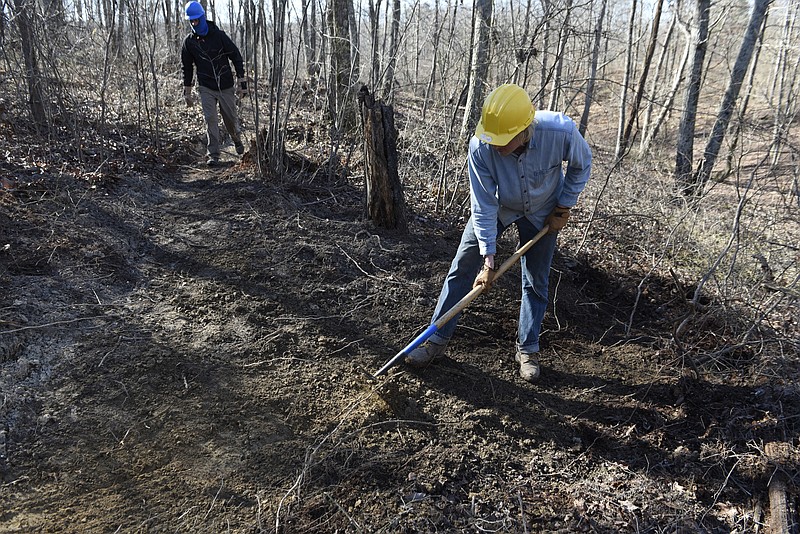 Dillon Brady, left, and Alexander Gold of the Southeast Conservation Corps work on a new mountain biking trail at the Enterprise South Nature Park on Monday, Jan. 18, 2016, in Chattanooga, Tenn.