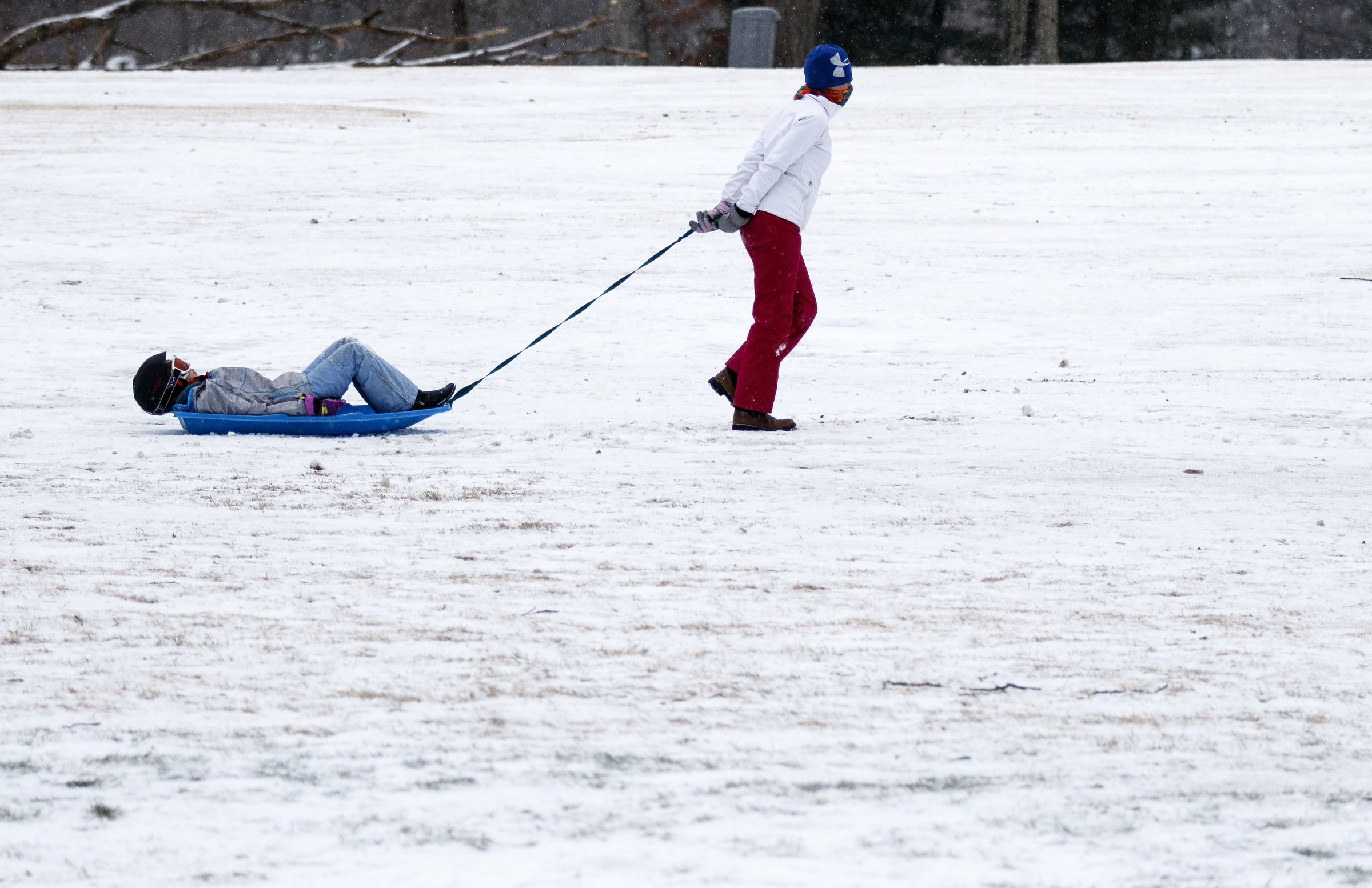 Laura Duncan pulls her daughter Skyla Duncan up a hill while sledding on a fairway of the Signal Mountain Golf and Country Club after winter storm Jonas swept across the Eastern United States on Saturday, January 23, 2016, in Signal Mountain, Tenn. While much of the East Coast received heavy snowfall, the Tennessee Valley was less effected.