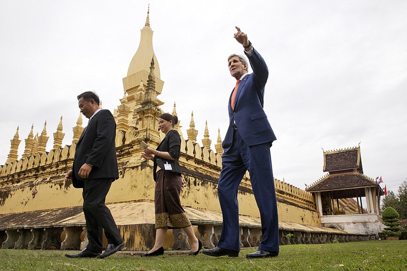 
              U.S. Secretary of State John Kerry, right, tours Pha Tha Luang in Vientiane, with Phouvieng Phothisane, acting director of the Vientiane Museums, far left, and Tata Keovilay, with the U.S. Embassy, Laos, Monday, Jan. 25, 2016. The massive gold stupa is the most important national symbol in Laos. Kerry is in Laos on the third leg of his latest round-the-world diplomatic mission, which will also take him to Cambodia and China. (AP Photo/Jacquelyn Martin, Pool)
            