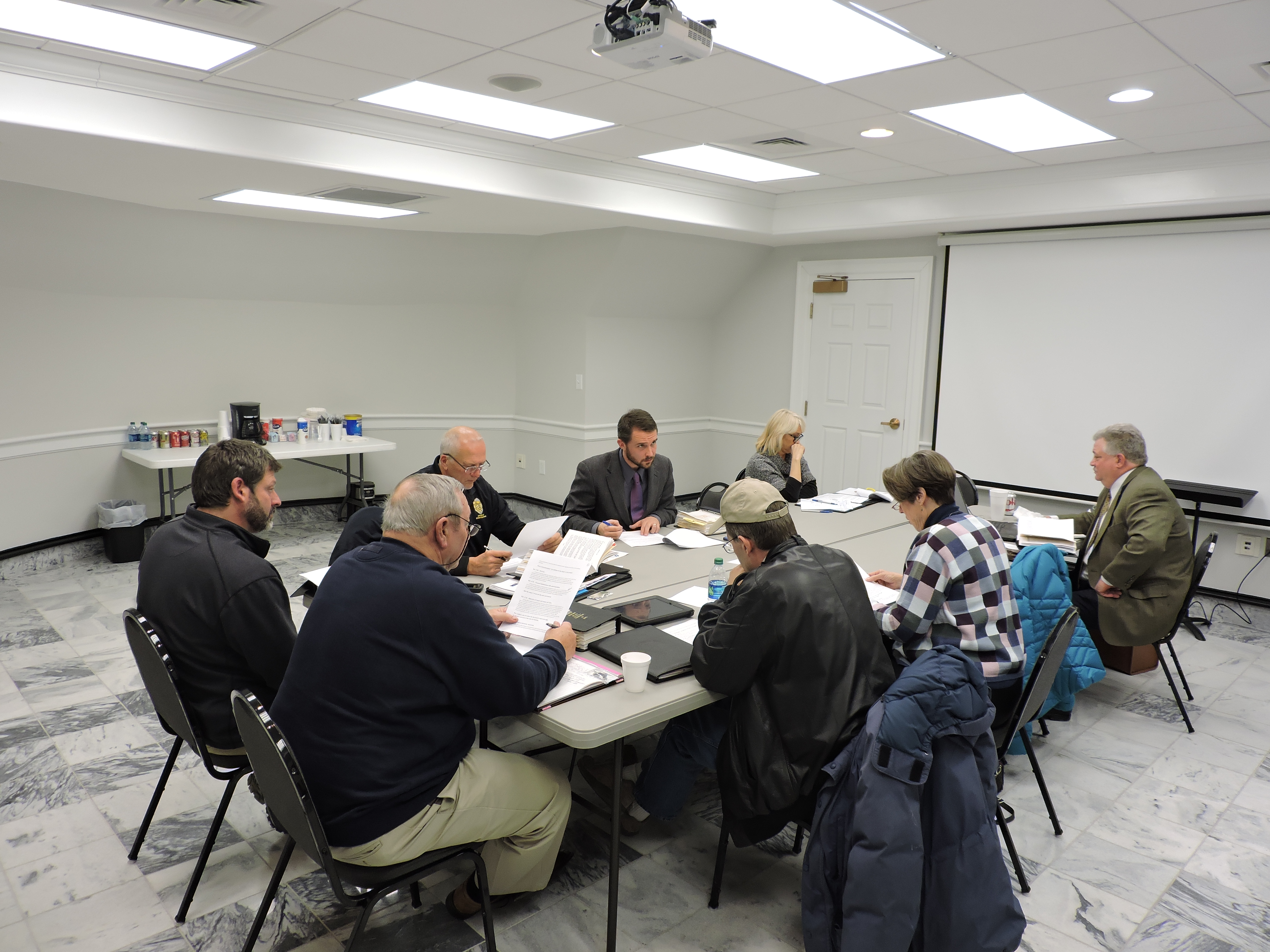 Clockwise from left are Vice Mayor Terry Crawford, Councilman Jake Haynes, Councilman Larry Black, Mayor Nick Millwood, City Recorder Nikki Lundeen, City Manager Dan Wright, Councilwoman Sara Clark and Councilman Randall Franks.