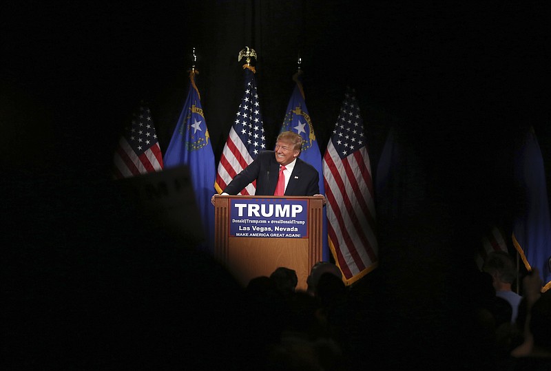 Republican presidential candidate Donald Trump smiles as he speaks during a campaign rally on Jan. 21 in Las Vegas.
