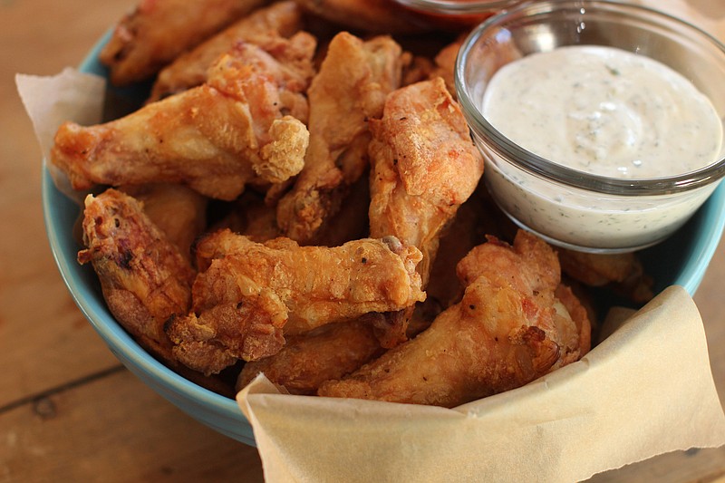 Hands-Off Party Wings require almost no effort from you. The secret is baking powder. (AP Photo/Matthew Mead)