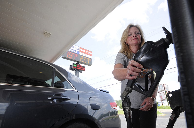 Memorial Pediatric Operating Room Nurse Georganne Hamilton fuels her car at the Save-A-Ton Citgo fuel stop at 5701 Highway 153. "I'm here just because of the gas price," Hamilton said. "I hope it stays this way."