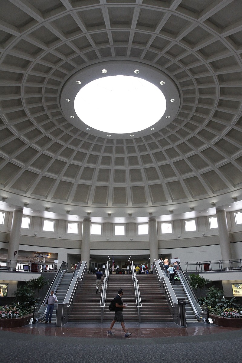 John Shipp walks through the atrium at Chattanooga Metropolitan Airport. Passenger boarding is up for the second year is a row.