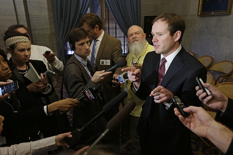 Rep. Jeremy Durham, R-Franklin, right, speaks with reporters following a House Republican caucus meeting on Jan. 12 in Nashville.