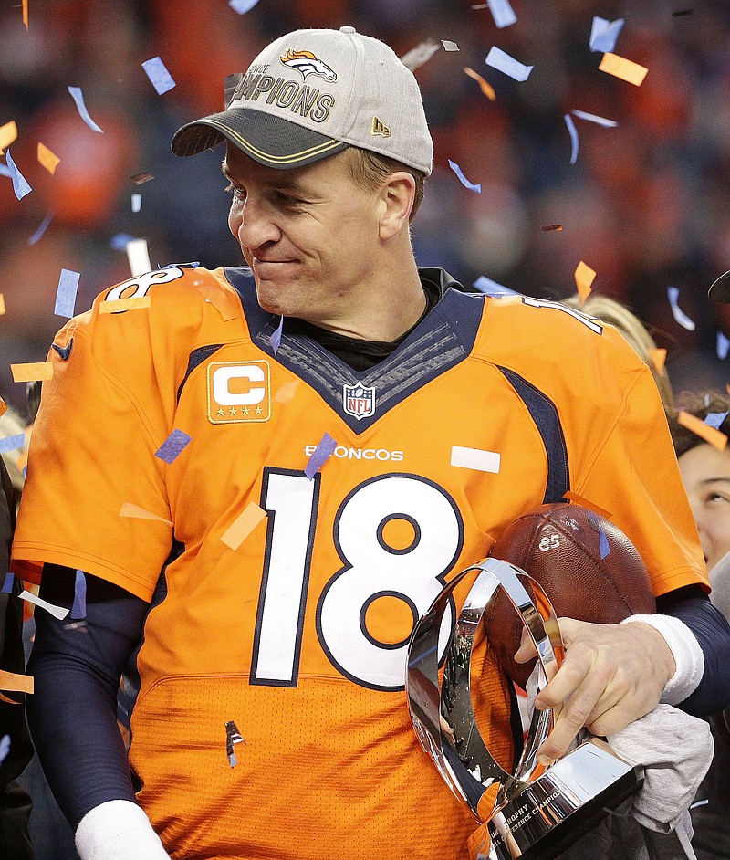 
              Denver Broncos quarterback Peyton Manning holds the AFC Championship trophy following the NFL football AFC Championship game between the Denver Broncos and the New England Patriots, Sunday, Jan. 24, 2016, in Denver. The Broncos defeated the Patriots 20-18 to advance to the Super Bowl. (AP Photo/Charlie Riedel)
            