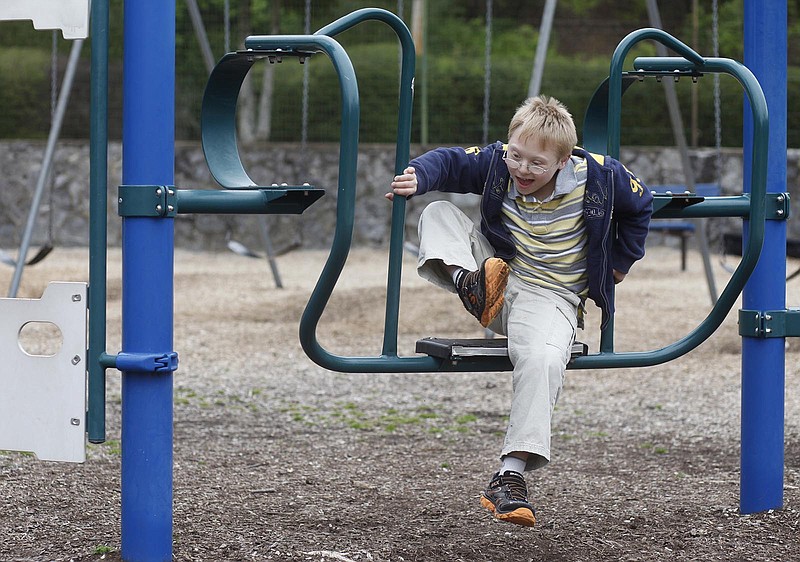 Luka Hyde, 9, who has Down syndrome, plays at Riverview Park in Chattanooga.