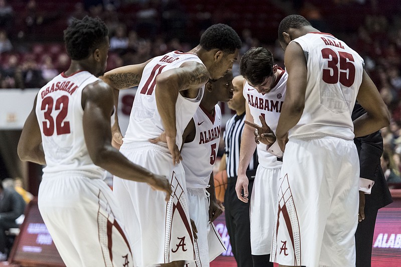 Alabama players huddle during an NCAA college basketball game against Tennessee on Tuesday, Jan. 26, 2016, in Tuscaloosa, Ala. Alabama won 63-57.