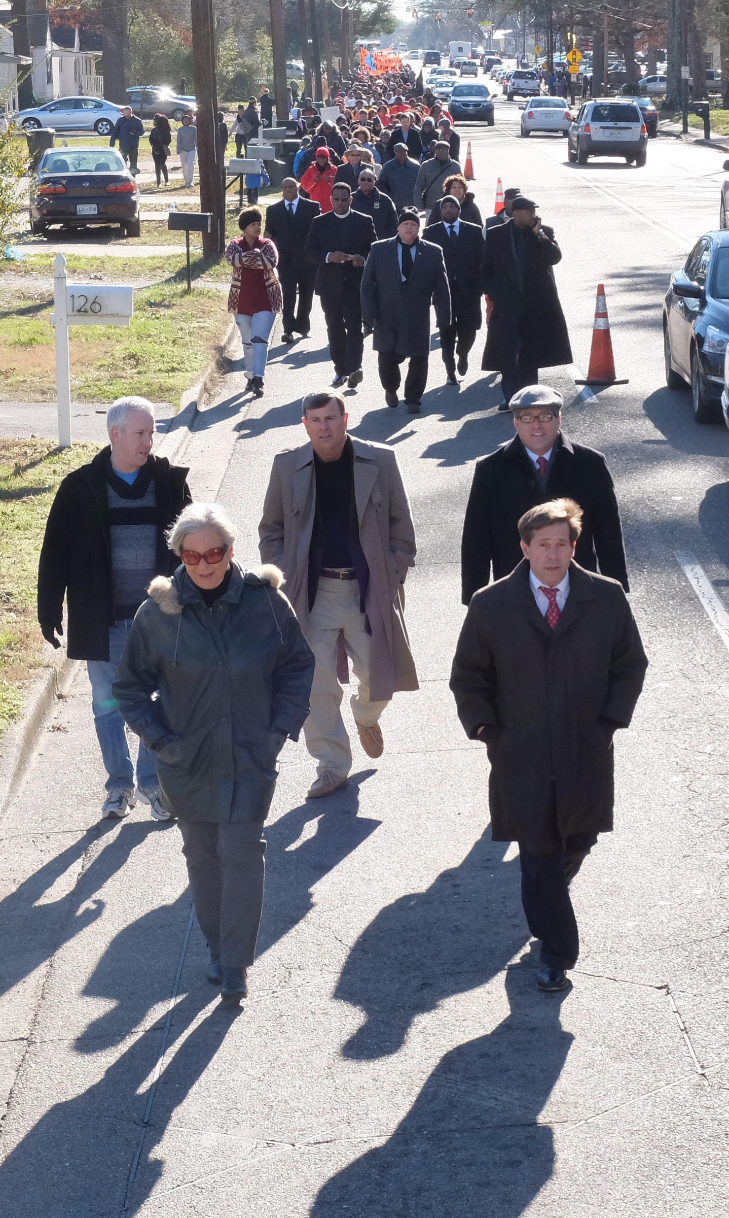 Chattanooga City Councilwoman Carol Berz, left, and U.S. Rep. Chuck Fleischmann walk ahead of hundreds of participants in the annual M.L. King parade, which was moved to Brainerd this year.