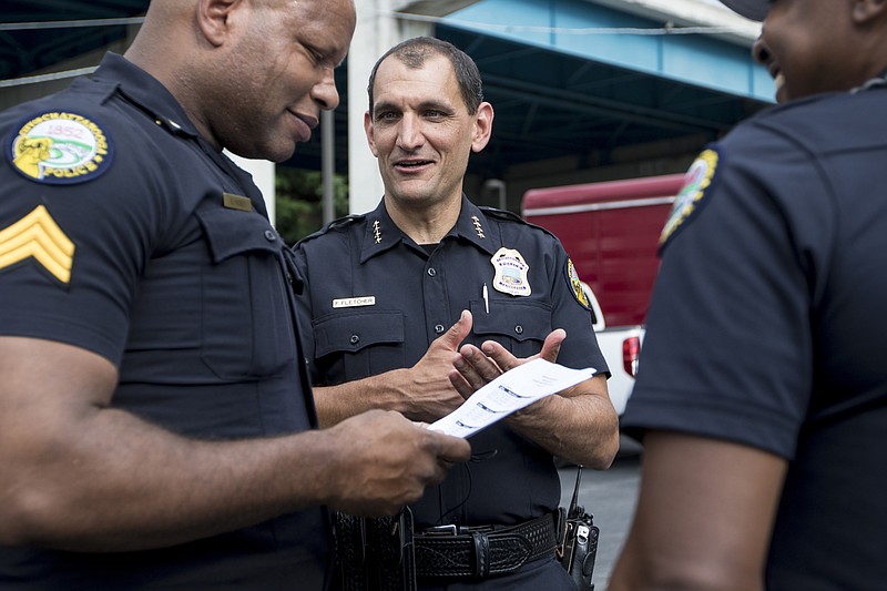 Chattanooga Police Chief Fred Fletcher, right, talks to Sgt. Shawn Hickey before the start of last year's Riverbend Festival.