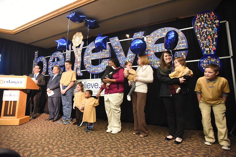 Erlanger CEO Kevin Spiegel, left, speaks during a press conference at Erlanger Wednesday, January 27, 2016 to discuss future plans for the Children's Outpatient Center. Children's Hospital at Erlanger CEO Don Mueller, Garrett Saylors, Cheyenne Lingerfelt, Cassius Finch, Vernita Finch, holding Anais Finch, Heather Underwood, holding Bailey Underwood, Bekah Miralles, holding Max Miralles and Aiden Brown, from left, listen.