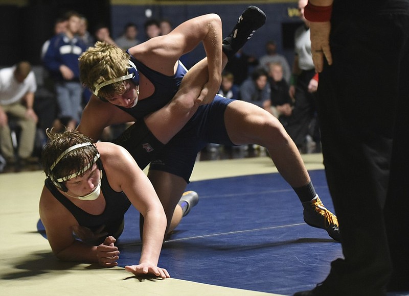 Soddy-Daisy's Ty Boeck, top, finishes a takedown of Bradley Central's Kevin Gentry in their 182-pound match Tuesday night at Soddy-Daisy. Boeck won by major decision, 17-7. Bradley Central will be joined by Cleveland and Walker Valley tonight at Soddy-Daisy for the Region 4-AAA duals, from which the top two teams advance to state.