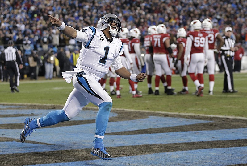 
              FILe - In this jan. 24, 2016, file photo, Carolina Panthers' Cam Newton celebrates his touchdown run during the first half the NFL football NFC Championship game against the Arizona Cardinals, n Charlotte, N.C. The Super Bowl bound Carolina Panthers have outscored their two playoff opponents 55-7 in the first half of games. (AP Photo/Chuck Burton, File)
            