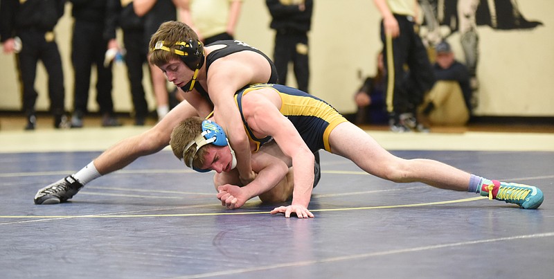 Bradley Central's Joshua LaCoe, top, locks on to Walker Valley's Ethan West before getting the pin at 5:53 in the 126-pound weight class Thursday at Soddy-Daisy.