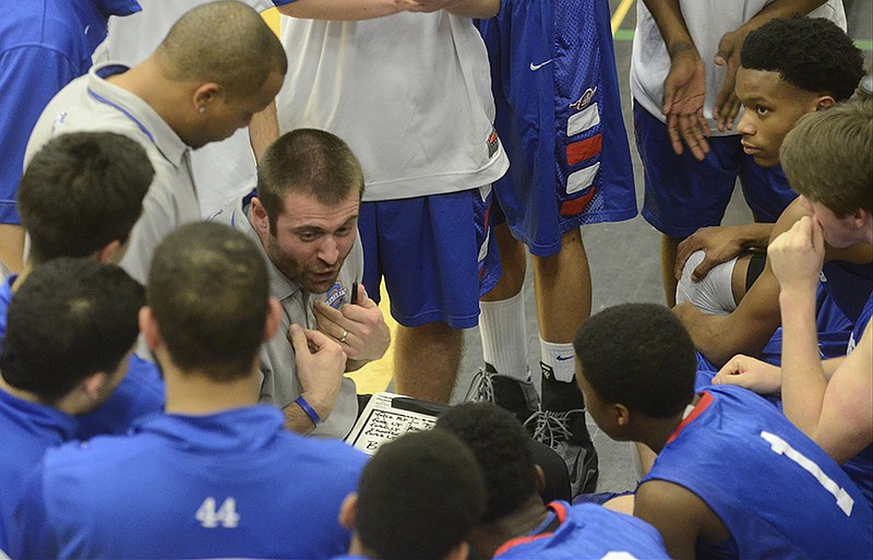 Feb 19, 2014--
Cleveland basketball coach Jason McCowan talks to players during the game against Walker Valley Tuesday at East Hamilton High School.