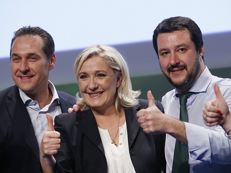 
              French National Front president Marine Le Pen, center, Italy's Northern League leader Matteo Salvini, right, and  Chairman of the Freedom Party of Austria Heinz Christian Strache pose at the end of  the Europe of Nations and Freedom movement meeting in Milan, Italy, Thursday, Jan. 28, 2016. (AP Photo/Antonio Calanni)
            