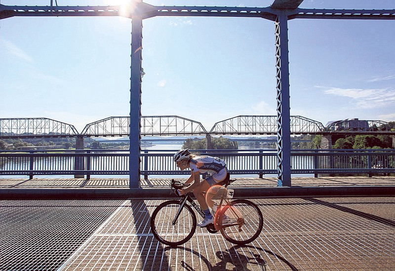 A racer crosses the Market Street Bridge in downtown Chattanooga during the Volkswagen USA Cycling Professional Women's Road Race National Championships.