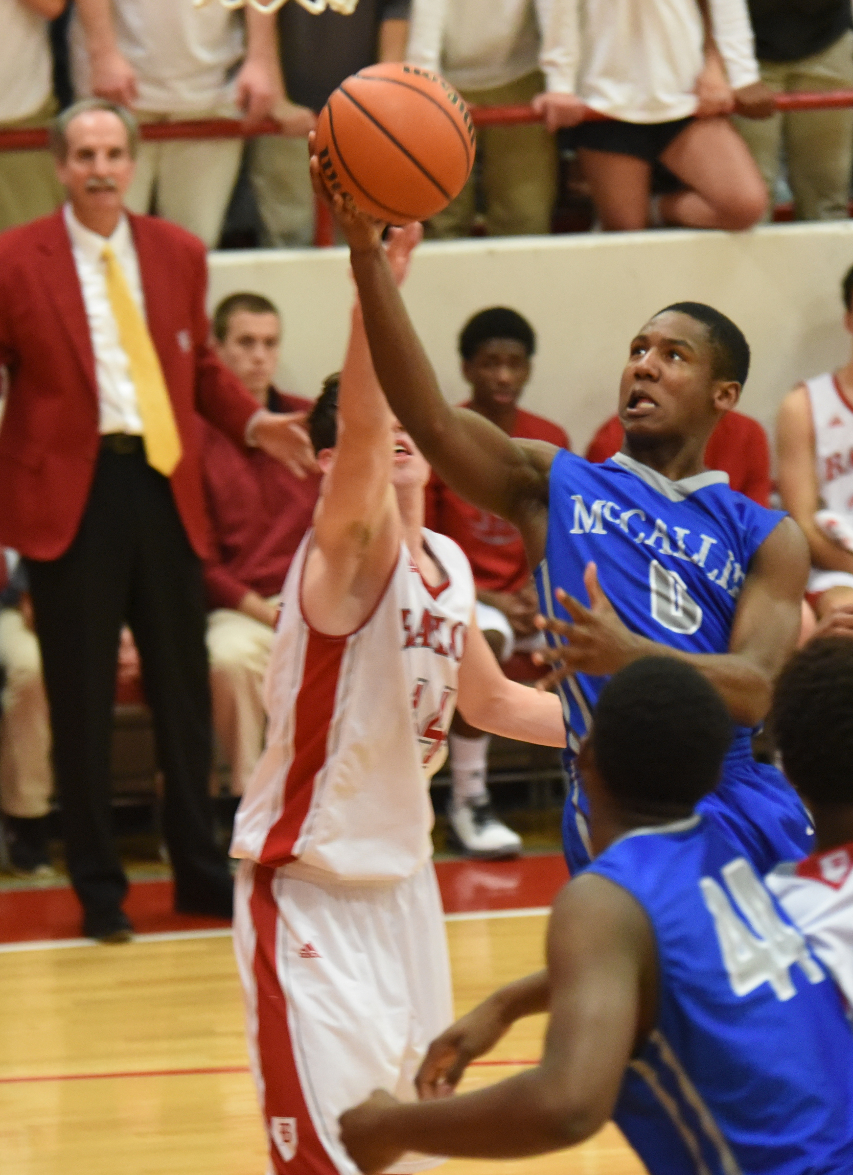 Baylor's Patrick Ureg (44) defends as McCallie's Ja Vaughn Craig (0) shoots a lay up in the paint in first half action at Baylor.