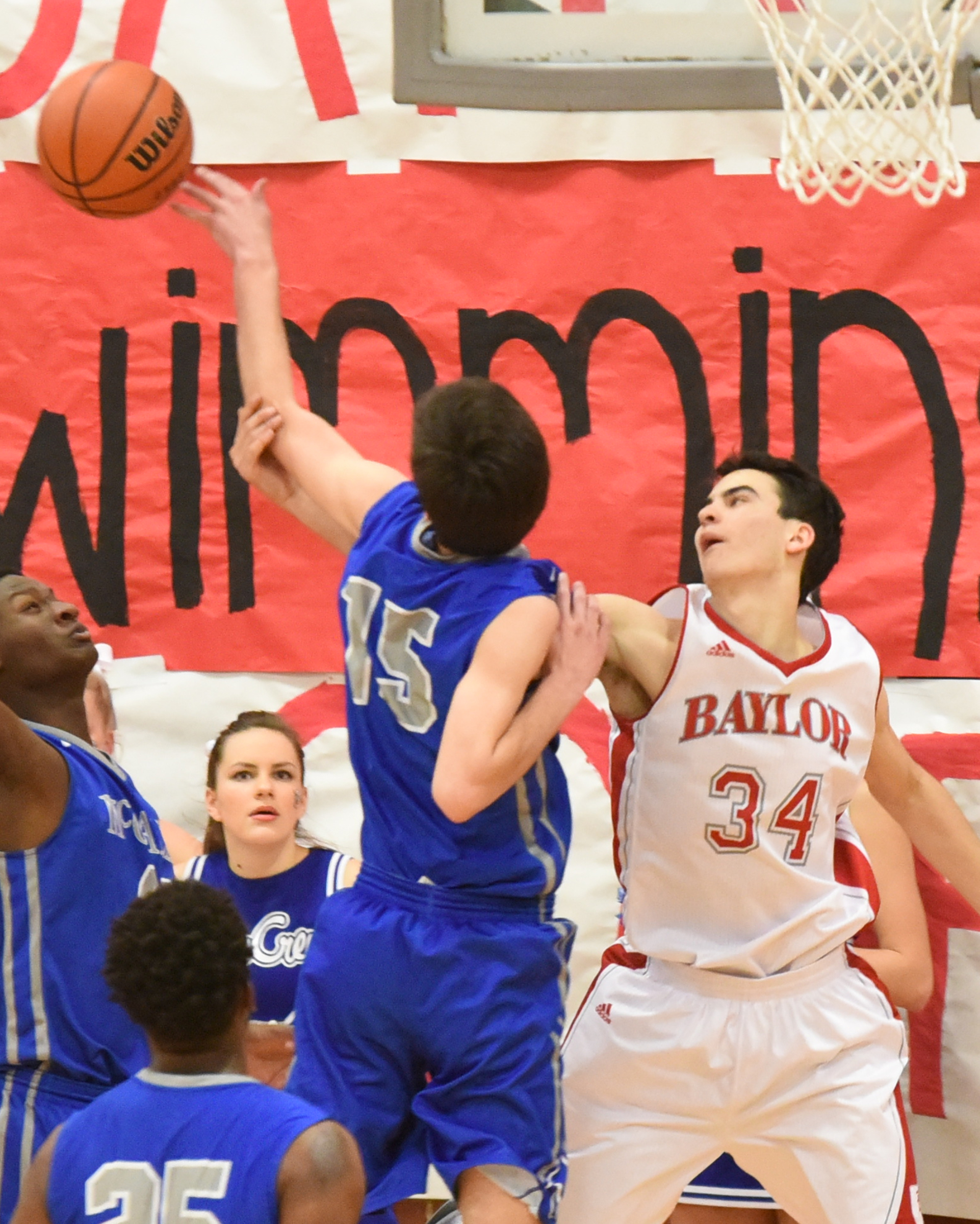 McCallie's Mac Hunt (15) is fouled by Baylor's Lorenzo White (34) on a rebound in third quarter action Friday night.